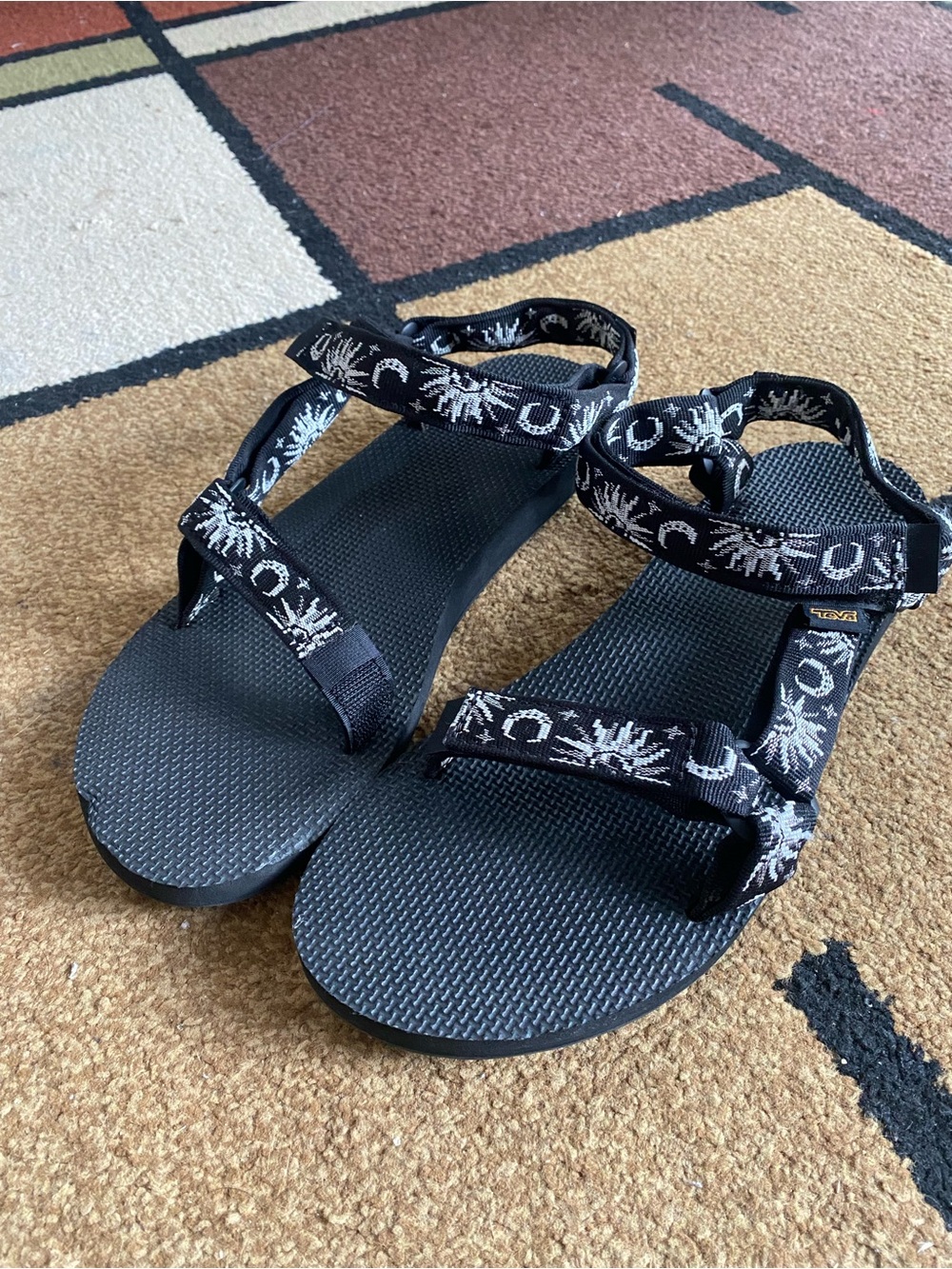 Teva Black Sandals with White Celestial Patterned Straps
